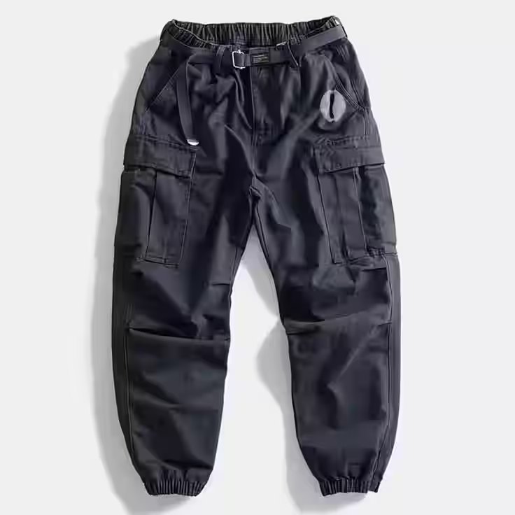 Navy cargo joggers with side pockets, a waist belt and elasticated cuffs