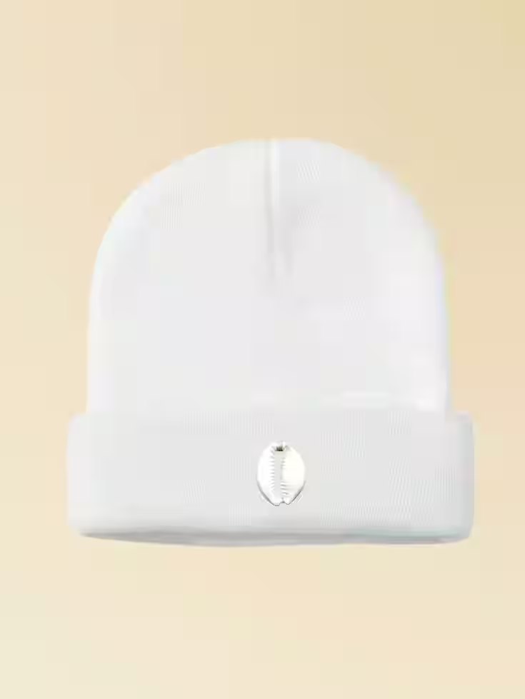 White cuffed beanie with a white cowrie emblem